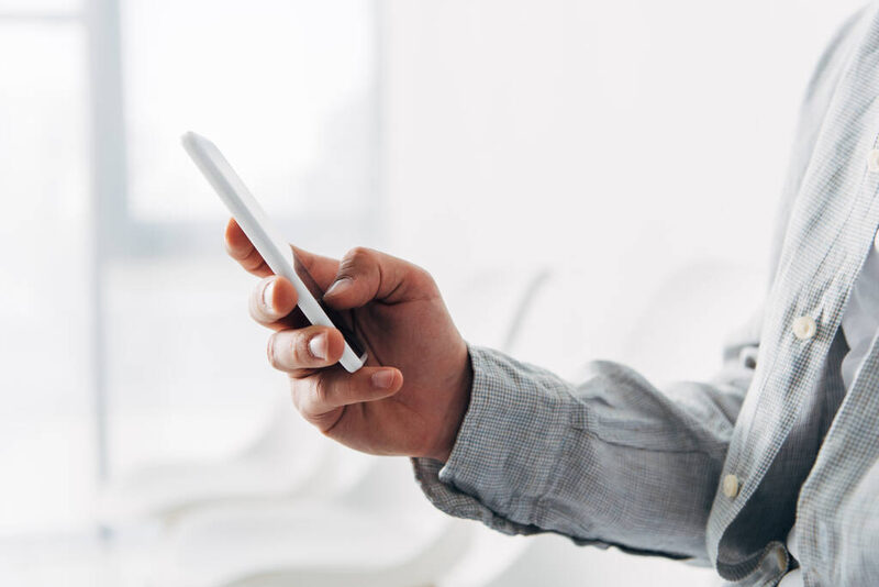 Smartphone held in hand showing enterprise application